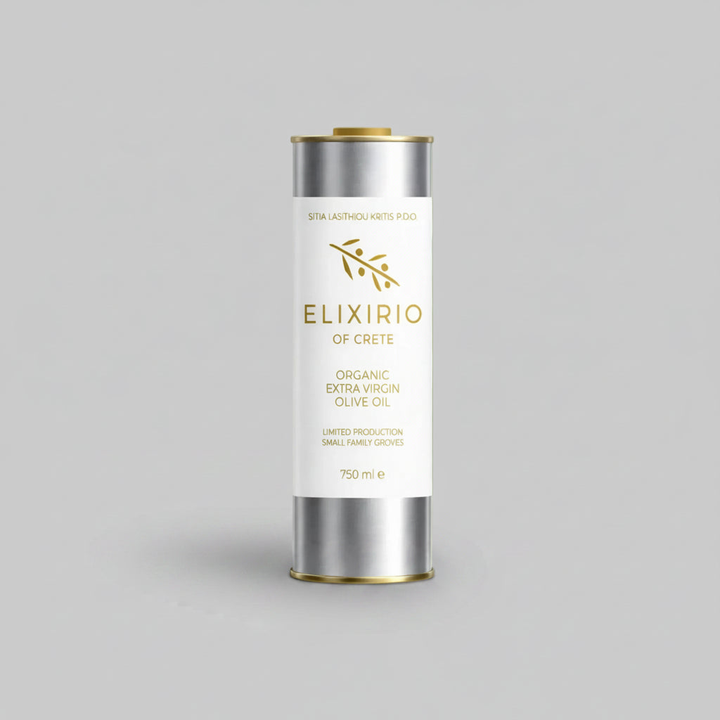 A silver cylindrical tin of Elixirio of Crete Organic Extra Virgin Olive Oil with a white label and gold accents, set against a solid gray background.