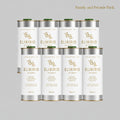 Eight white metal canisters of Elixirio of Crete organic extra virgin olive oil arranged in two rows of four on a solid gray background.